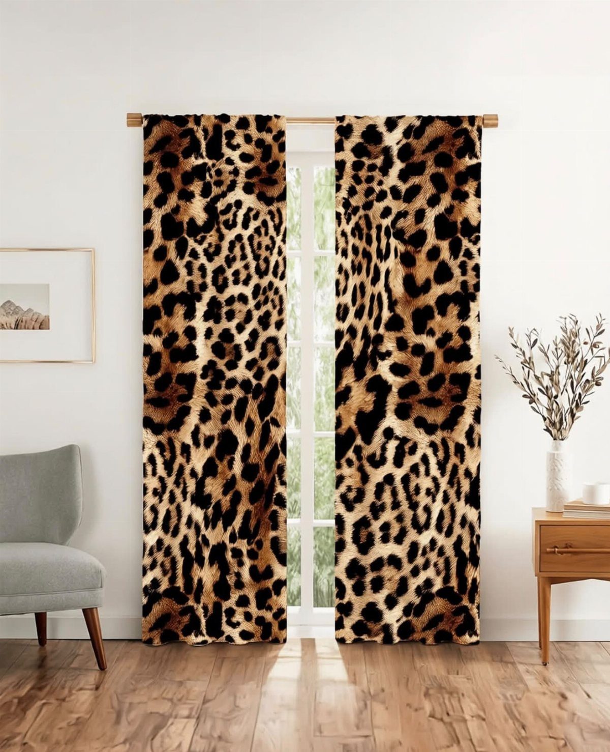 Cheetah print curtains hanging over a glass door in a bright modern room.