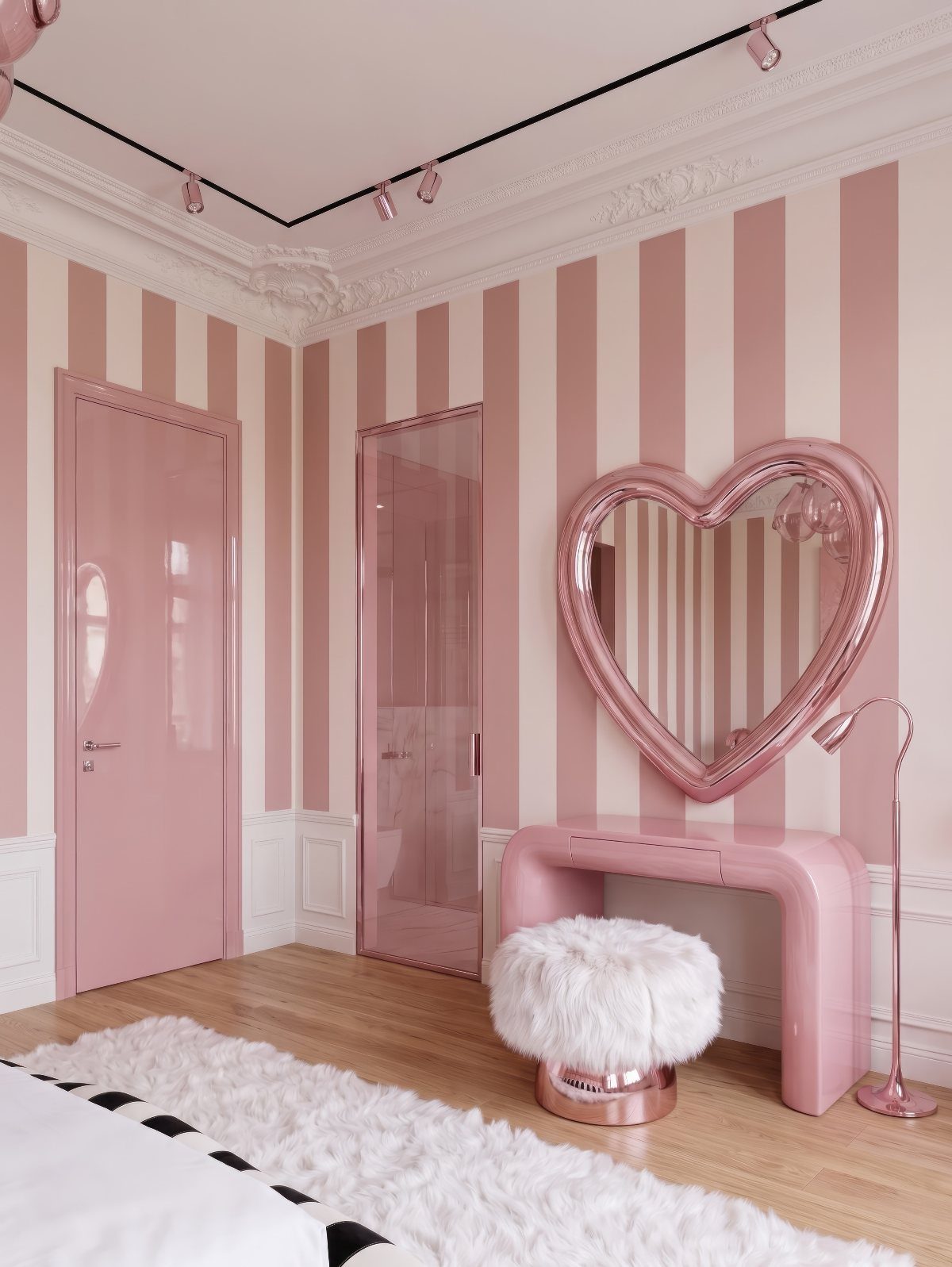 Pink striped bedroom with heart-shaped mirror, pink vanity, and white fluffy stool.