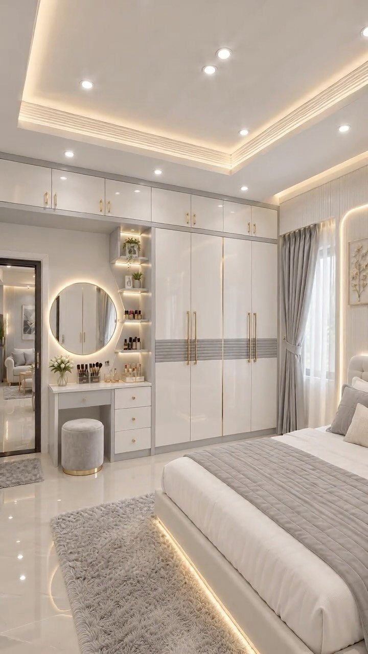 Luxury bedroom featuring a recessed tray ceiling with warm integrated cove lighting.