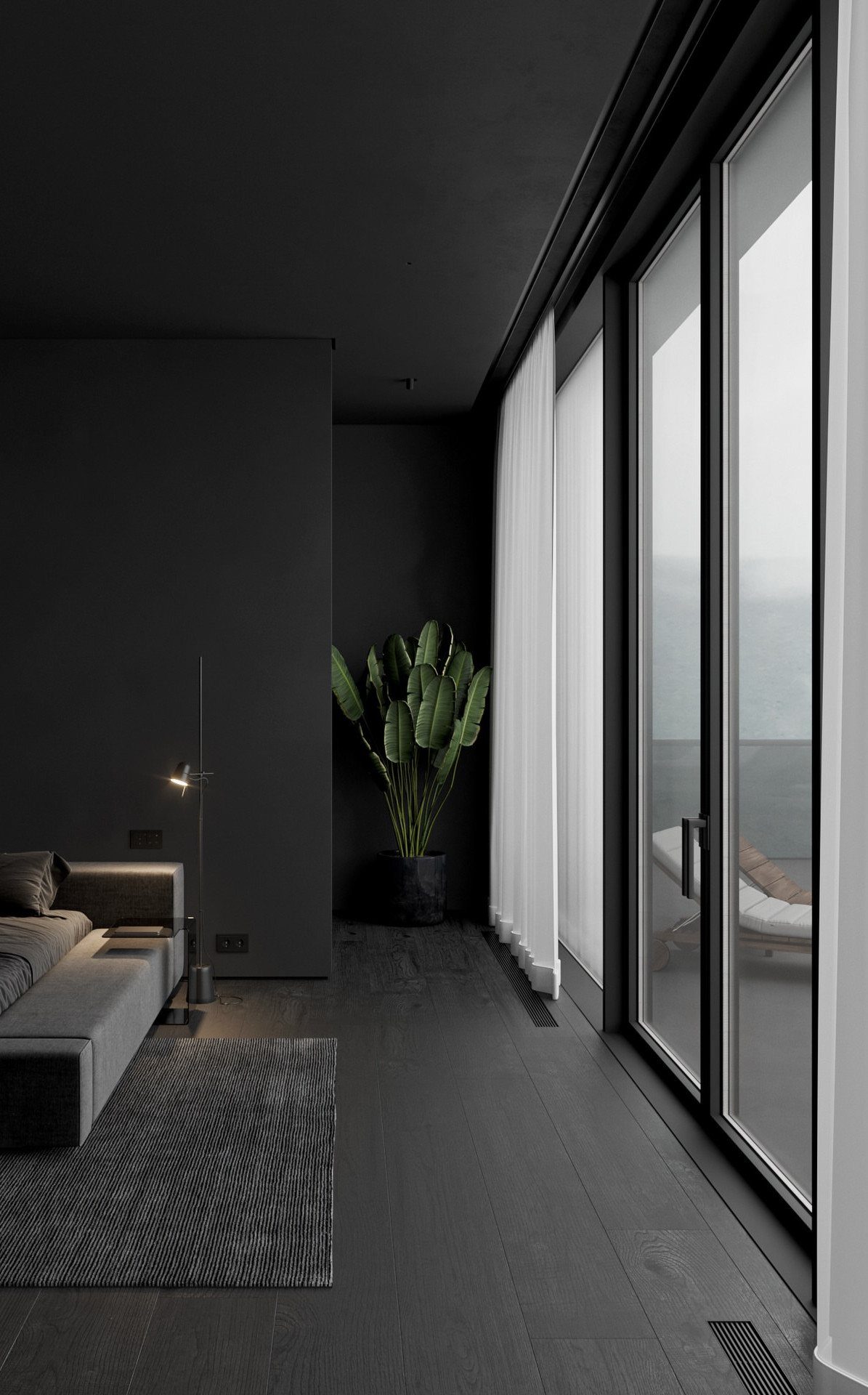 Modern bedroom with black walls and large glass doors letting in natural light.