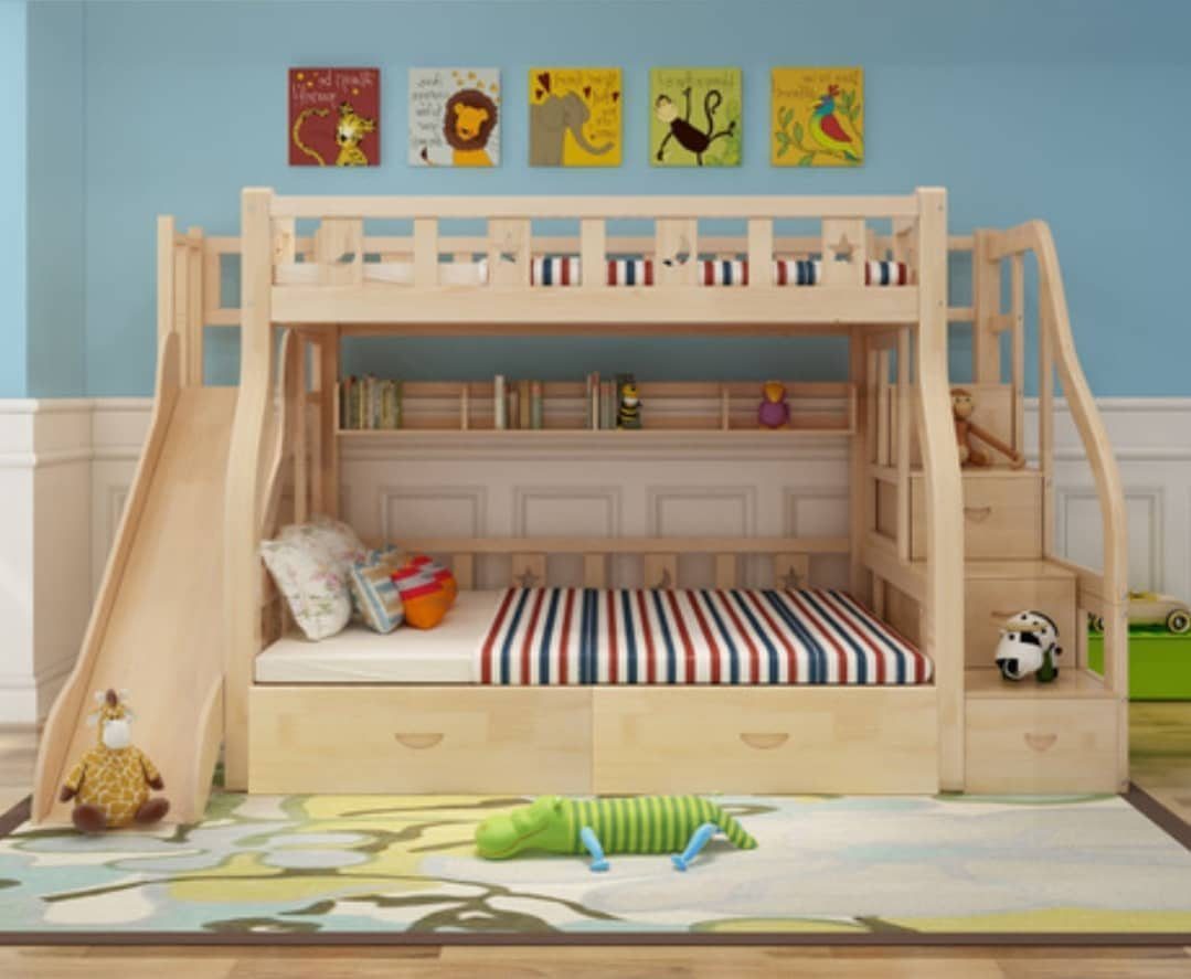 Wooden bunk bed with a slide, stairs, and storage in a child's bedroom.