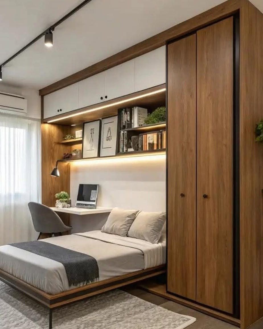 Compact white desk integrated into a wooden bedroom unit with a bed and wardrobe.