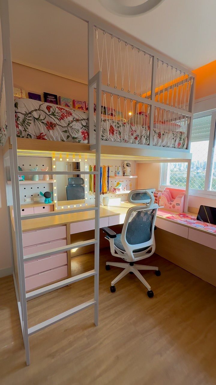 White loft bed with a desk, pink drawers, and office chair underneath.