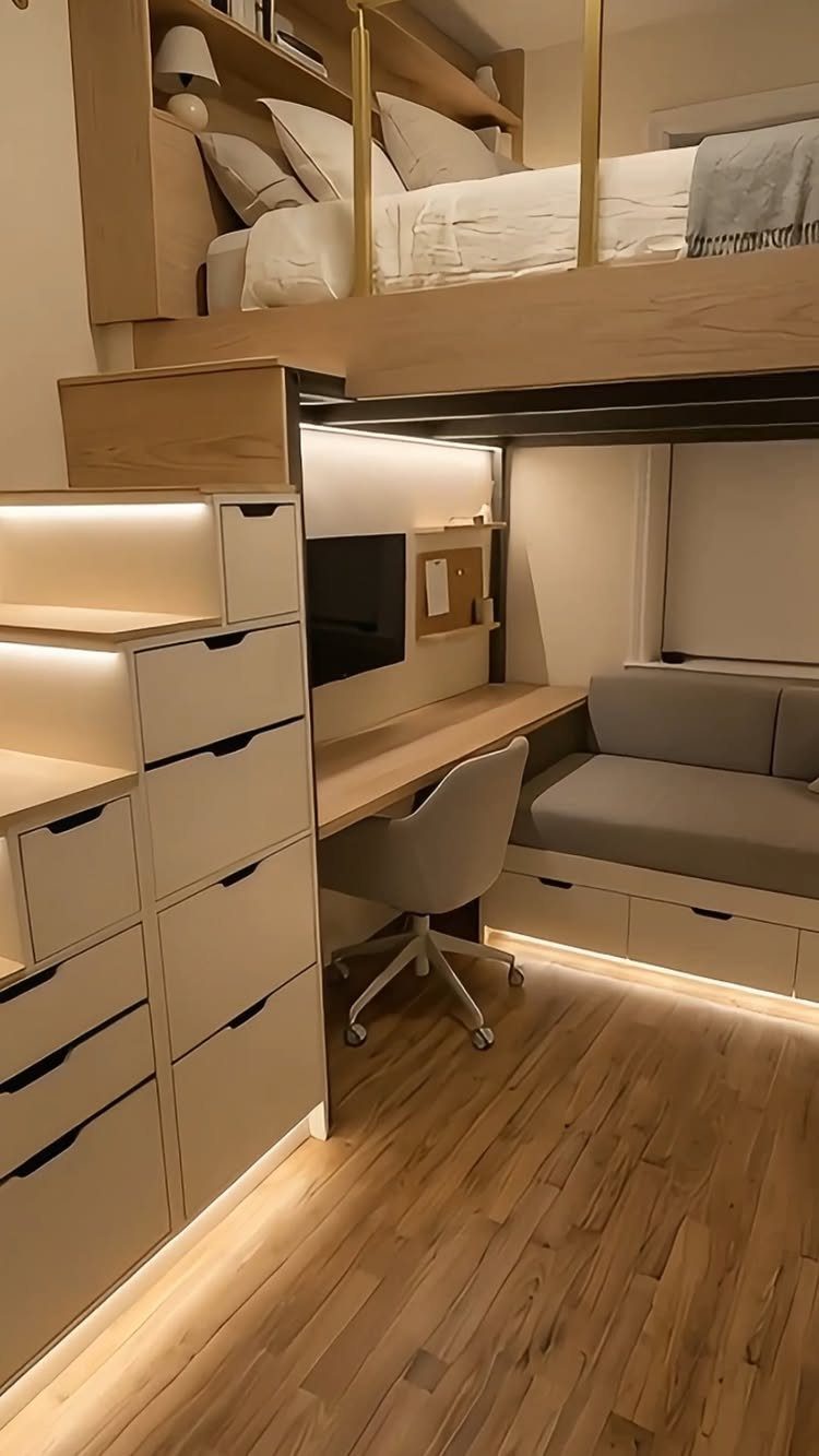 Loft bed with a built-in desk, office chair, and sofa underneath.