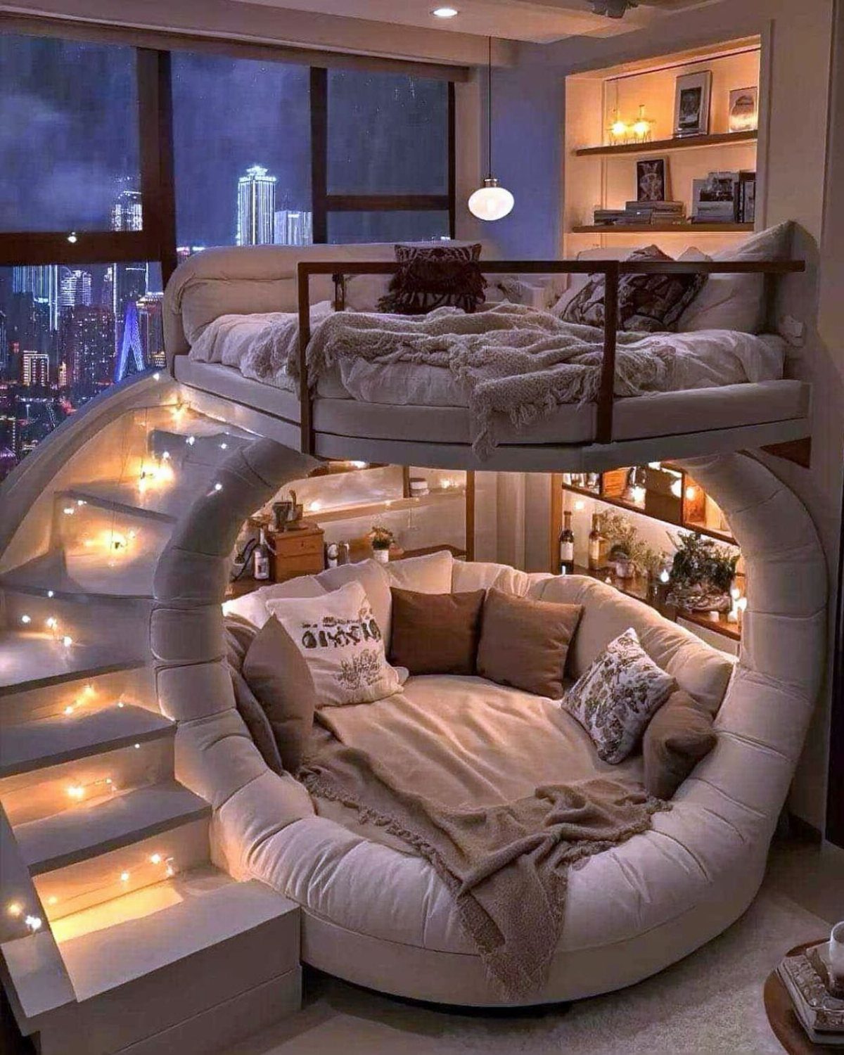 White curved loft bed with a cozy lounge area and illuminated stairs.