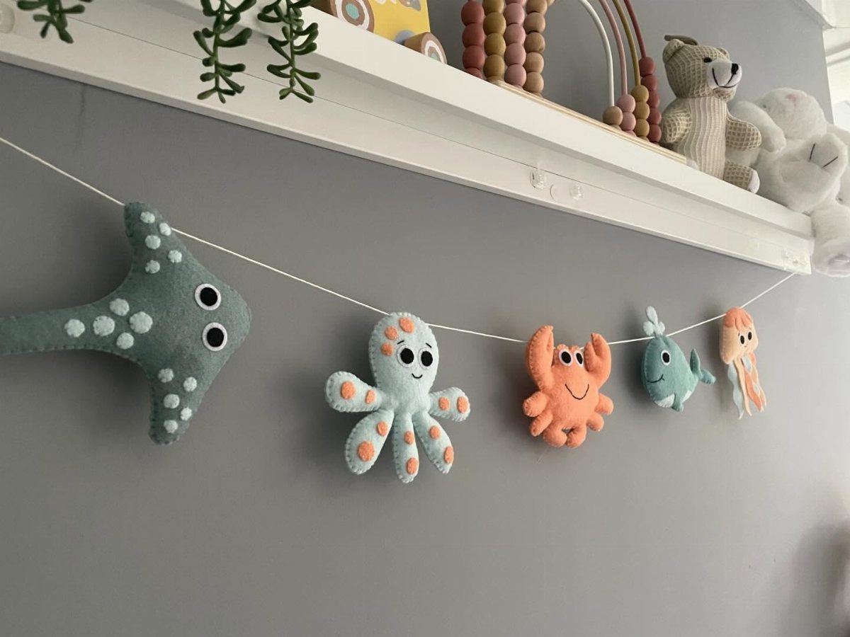 Felt ocean animal garland with a stingray, octopus, crab, fish, and jellyfish.