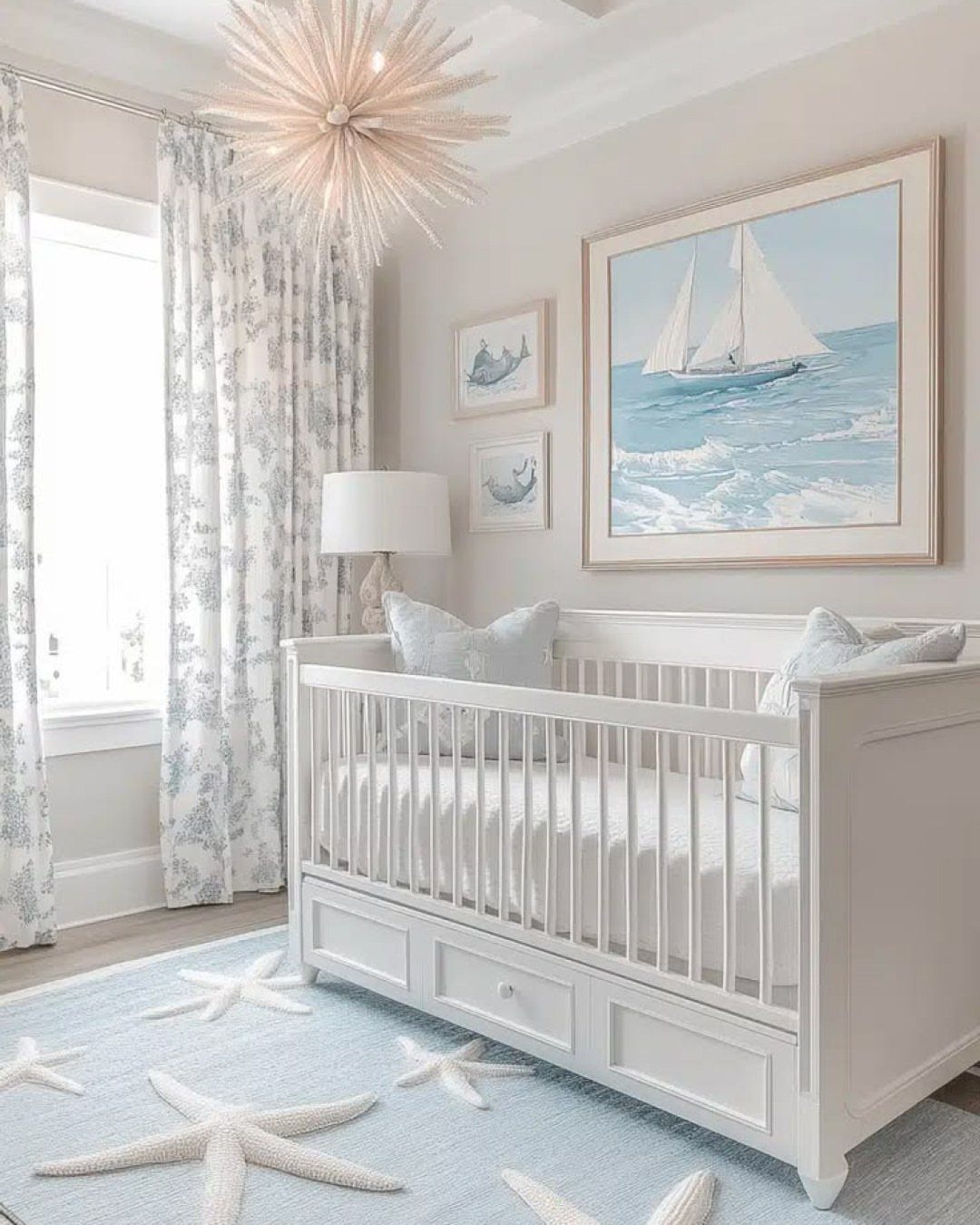 White wooden crib in a nursery with ocean paintings and starfish rug.