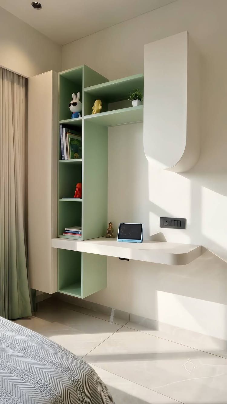 White floating desk with light green shelving unit installed in a modern bedroom