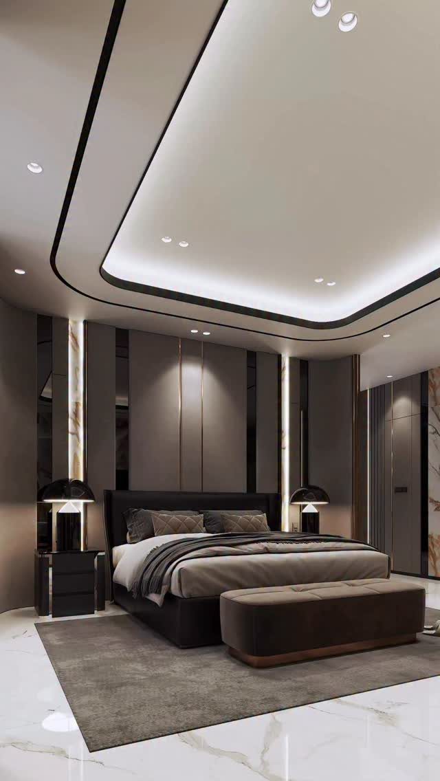Modern master bedroom with recessed ceiling lighting, bedside lamps, and neutral toned furniture.