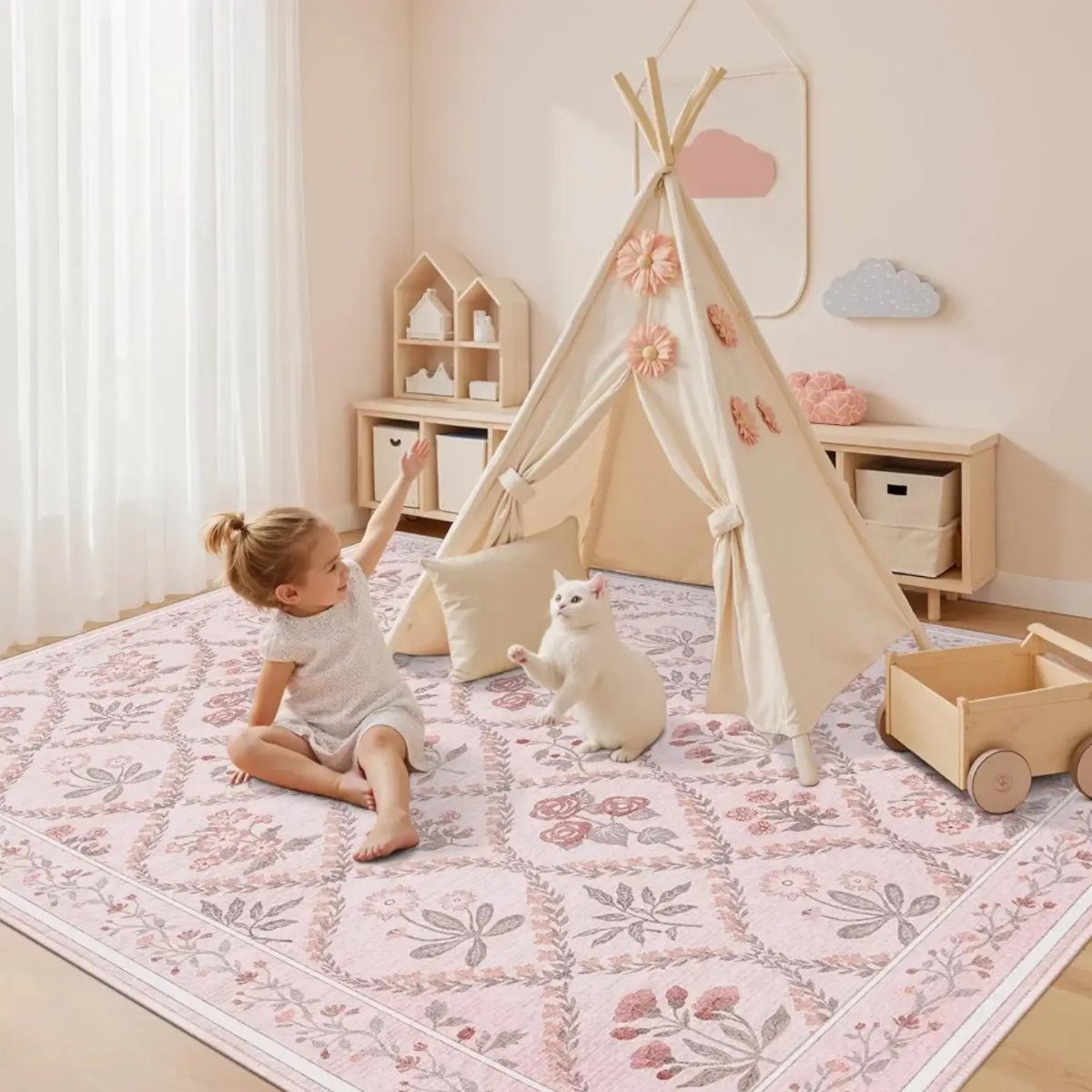 Floral patterned pink rug in a nursery with a child and a cat.
