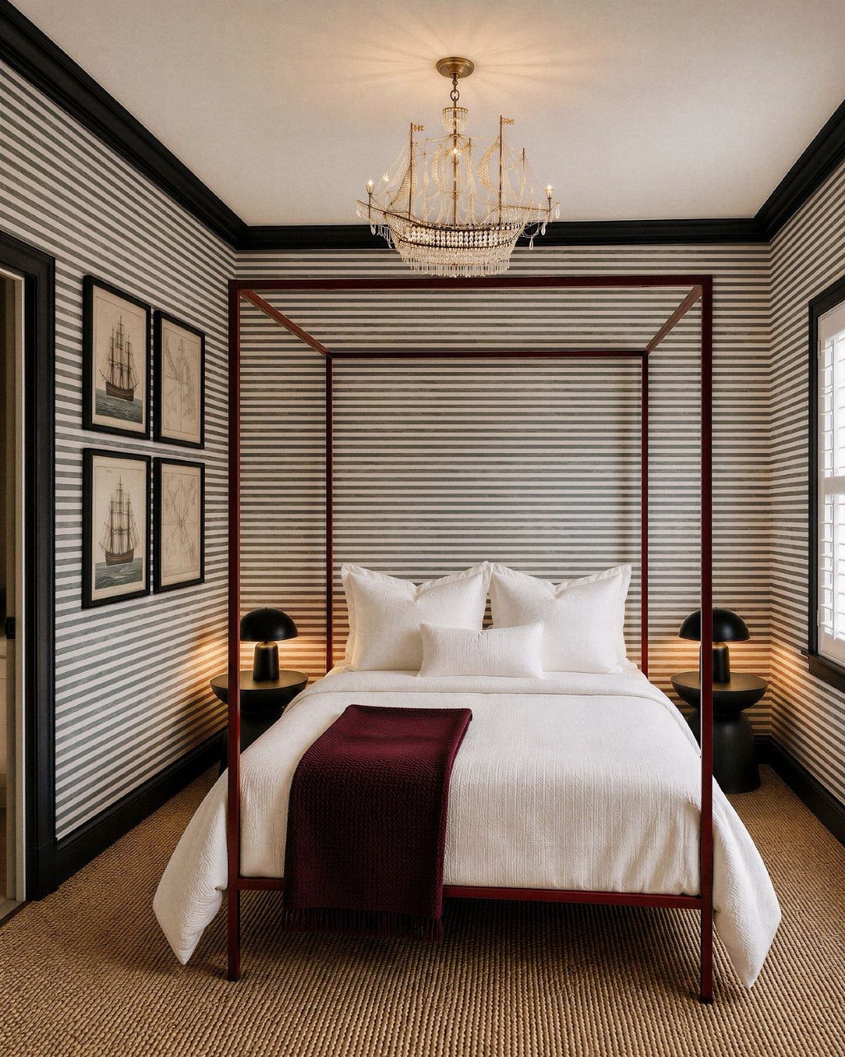 Canopy bed in a bedroom with horizontal black and white striped walls.