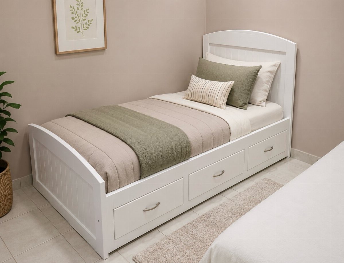White twin bed with built-in storage drawers, beige bedding, and green accents.