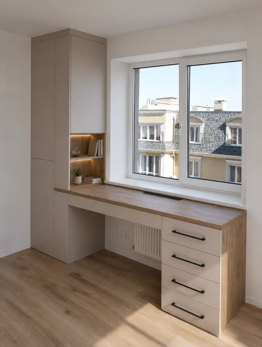 Built-in desk with overhead storage and drawers positioned under a bright window.