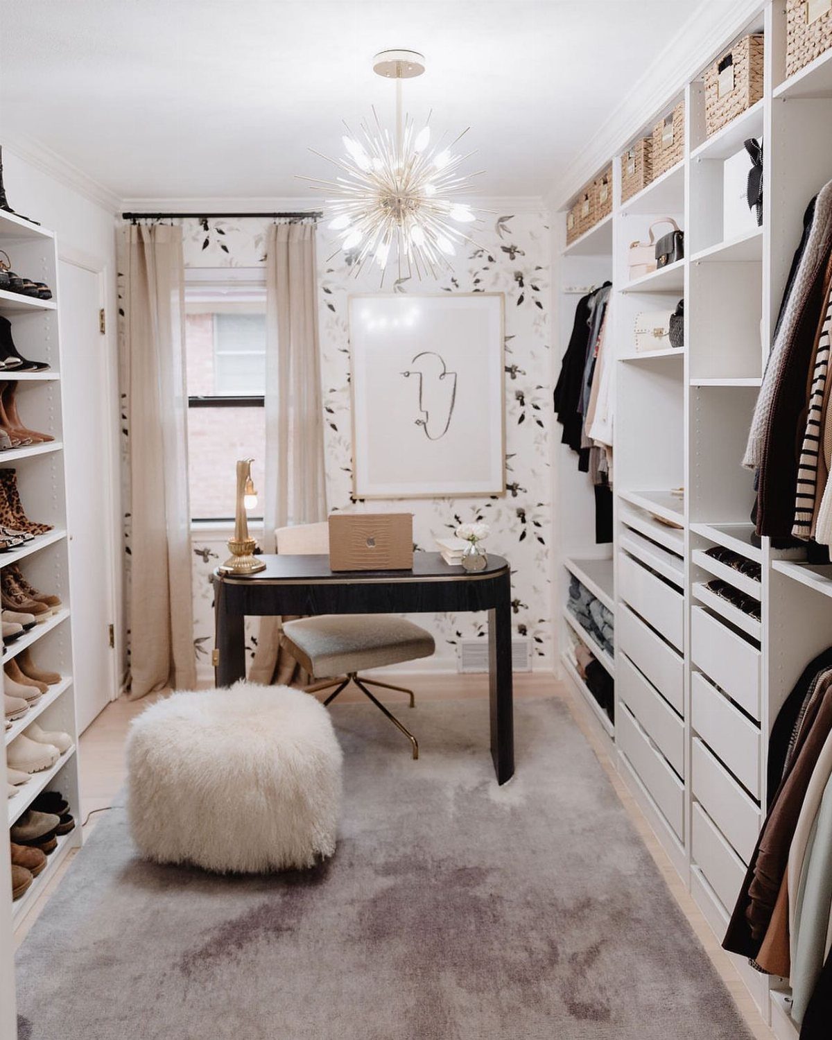 Black desk and chair set up inside a white walk-in closet office space