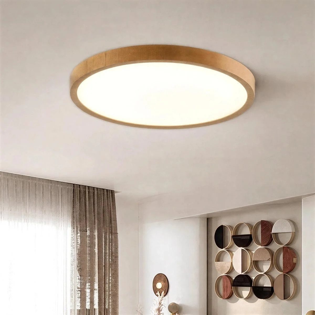 Slim round ceiling light with wood trim in a modern white room