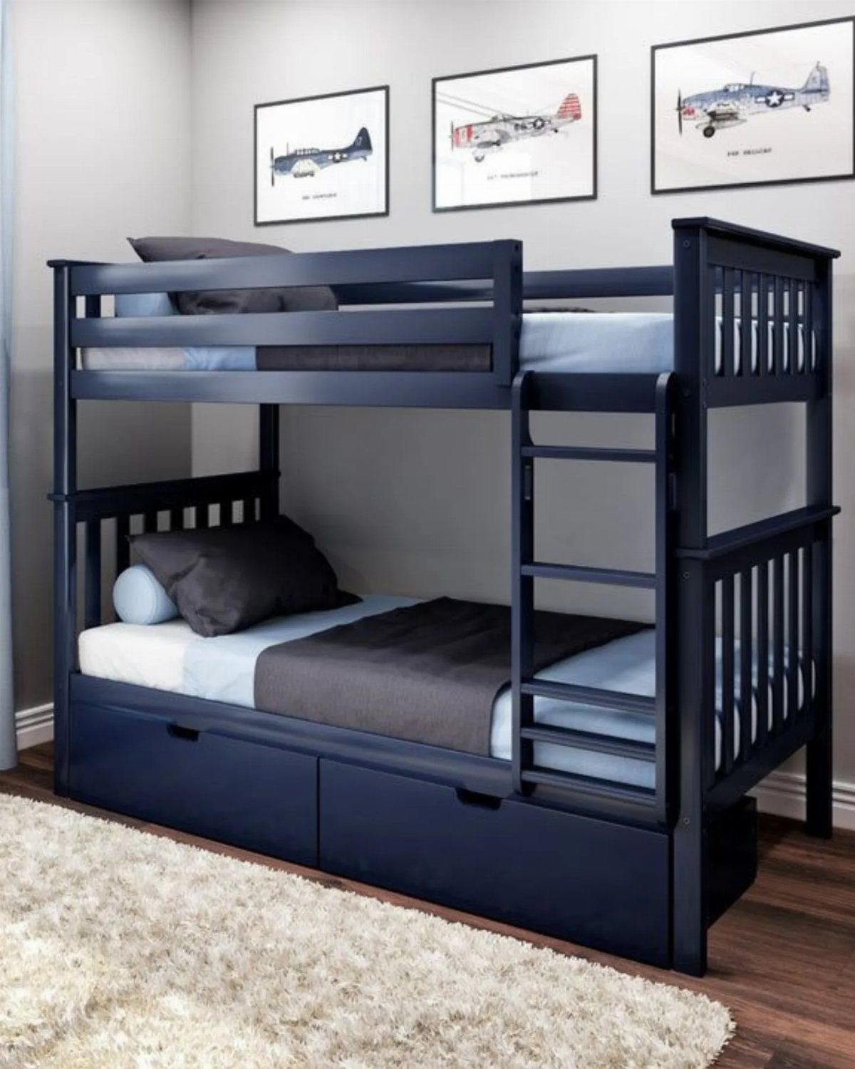 Dark navy blue bunk bed with trundle drawer in a grey bedroom